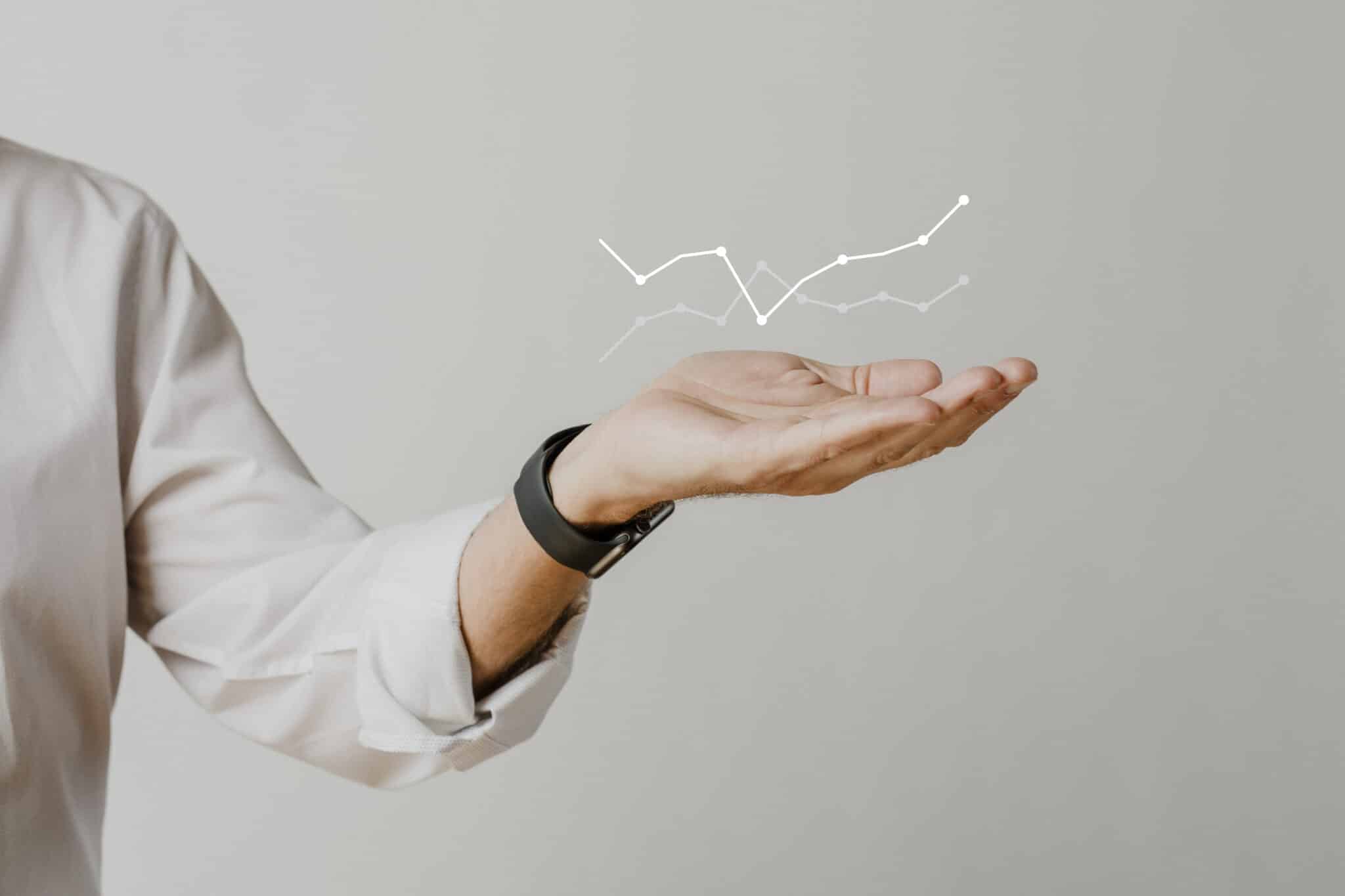 digital graph with businessman hand overlay scaled - Emir Al Kafadji